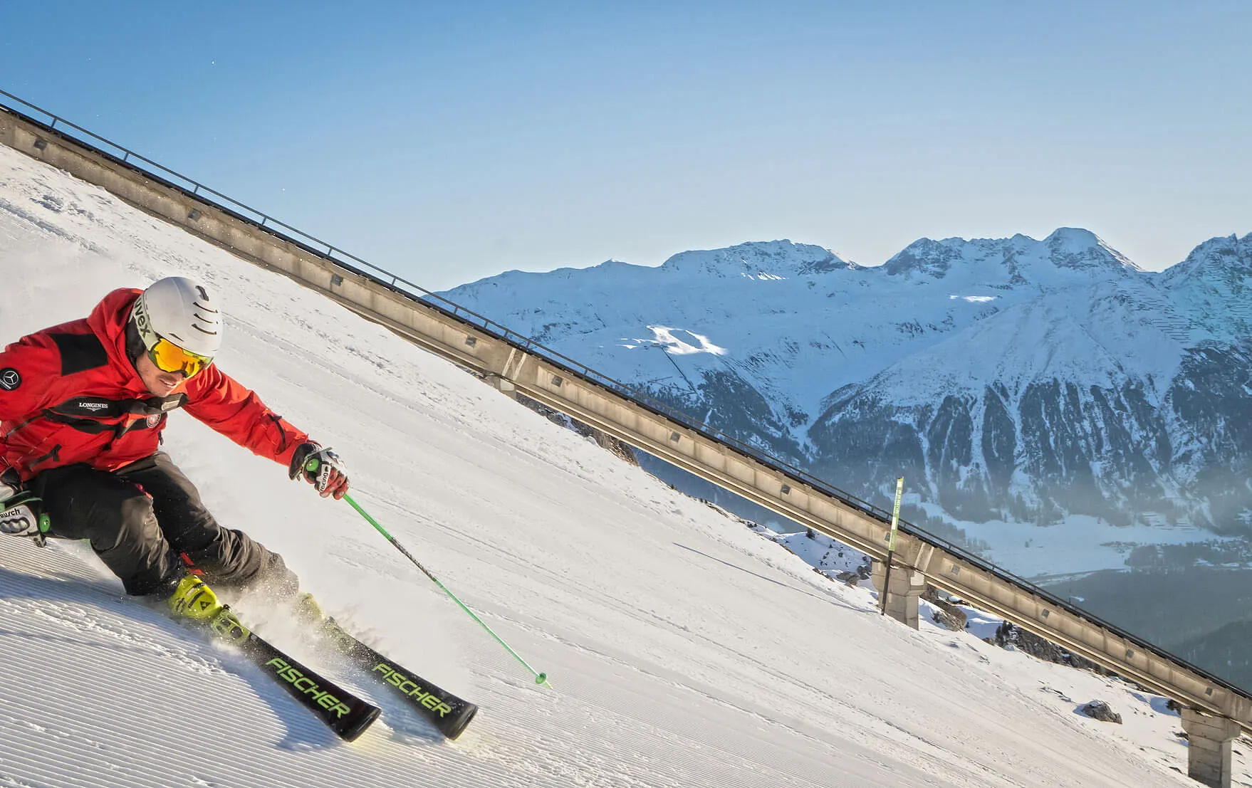 The Red Legends ski instructor skiing Muntanella black run at St Moritz Switzerland